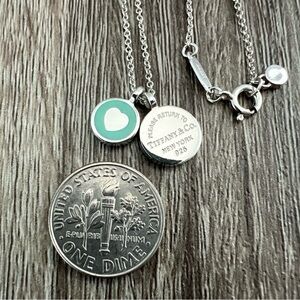 Tiffany & Co. blue enamel circle with heart cut out